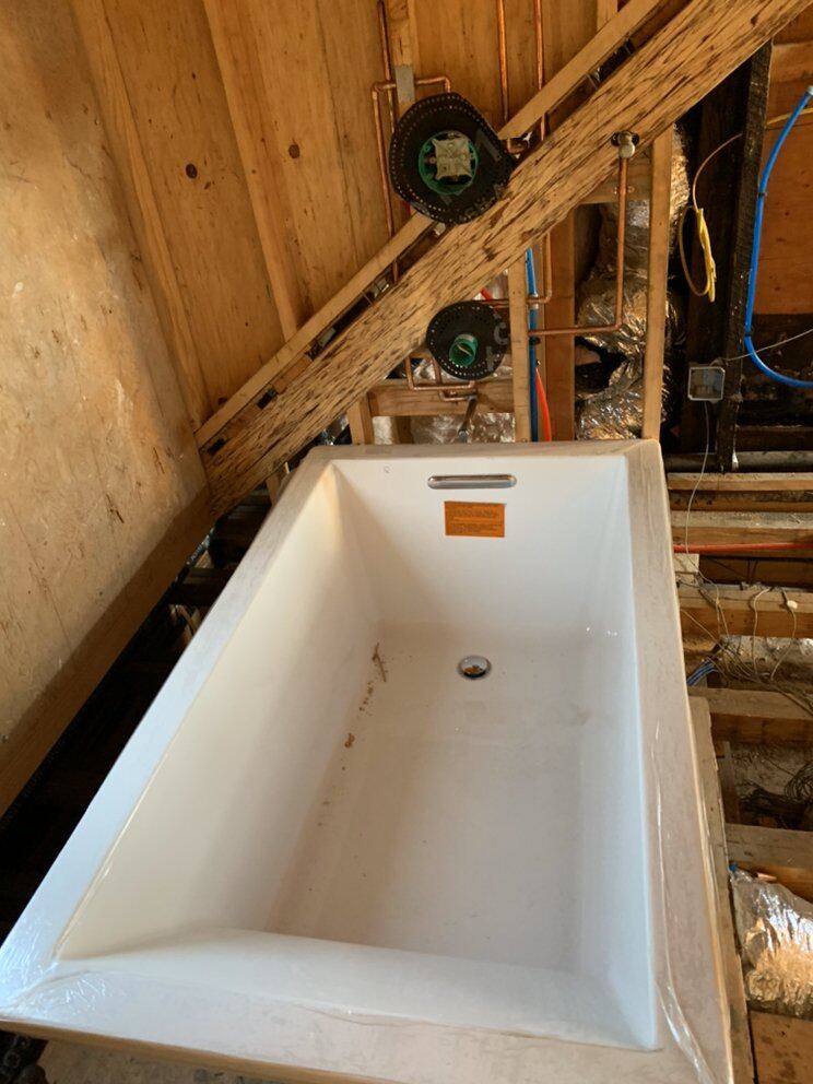 Tub set with rough-in valves before close-up